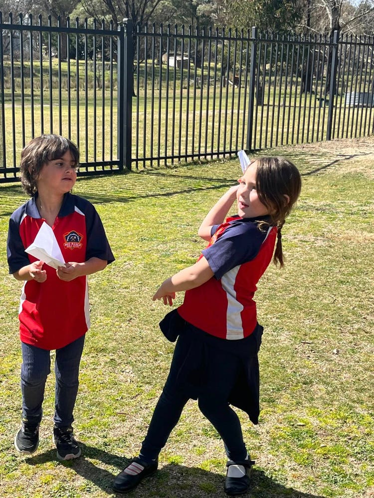 May be an image of 2 people, people playing soccer and grass